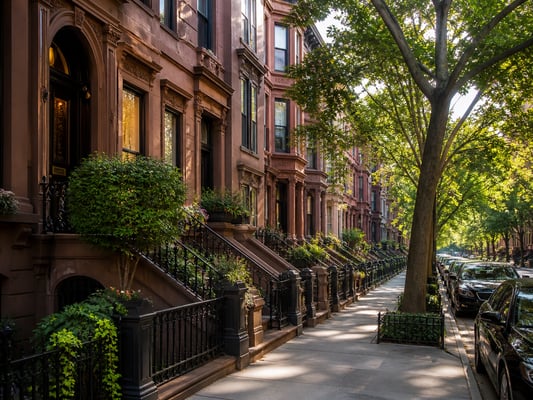 NYC brownstone stoops and row houses on a tree-lined Brooklyn block — classic New York City brownstone architecture