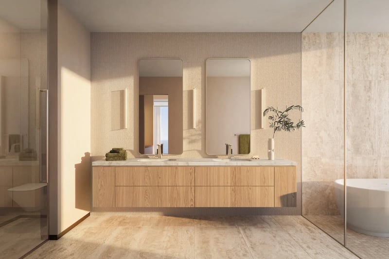 LILLI Miami Edgewater primary bathroom with freestanding soaking tub and honed marble vanity